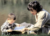 Boy and mom reading